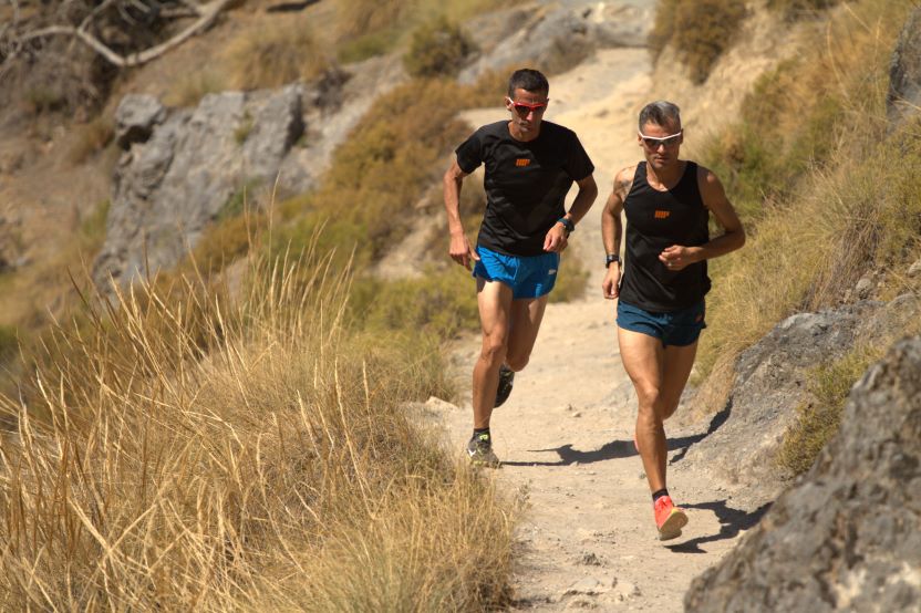 2 men run easy,on incredible trails surrounding Granada, south of Spain.