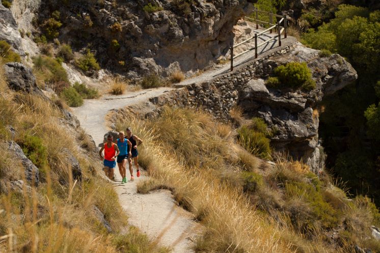 3 men running on the running trails that surround Granada, Southern Spain.